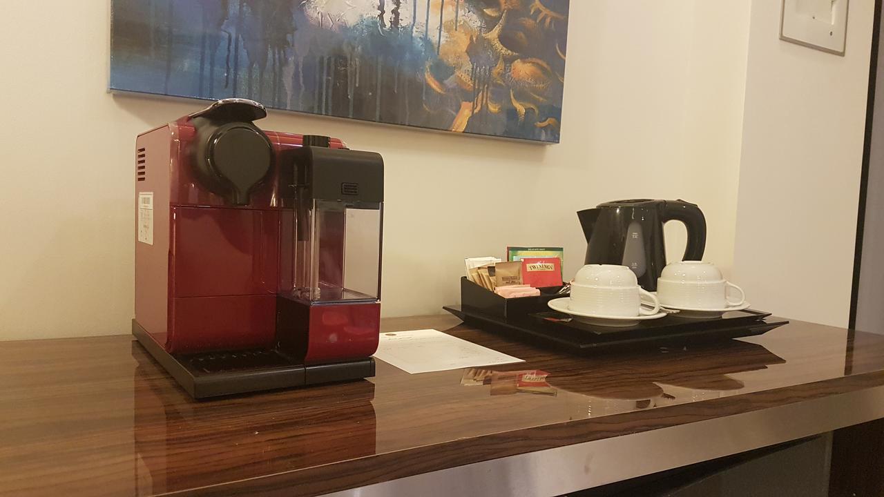 Tio Sea Resort Al Khor Kültér fotó A Nespresso coffee machine in a hotel room